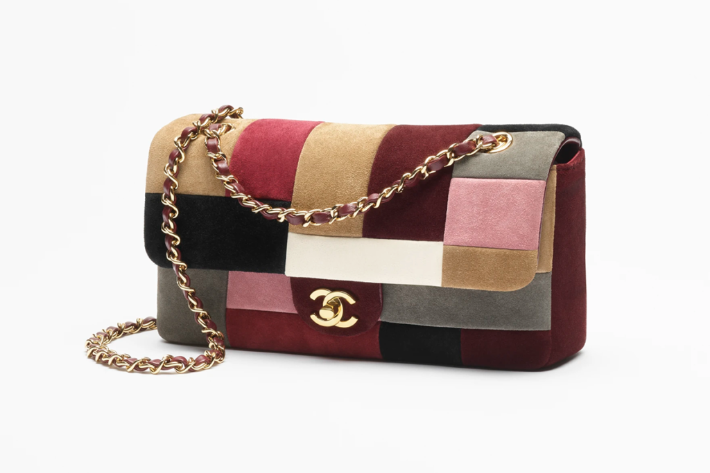 Pre-owned patchwork Chanel handbag with a gold chain