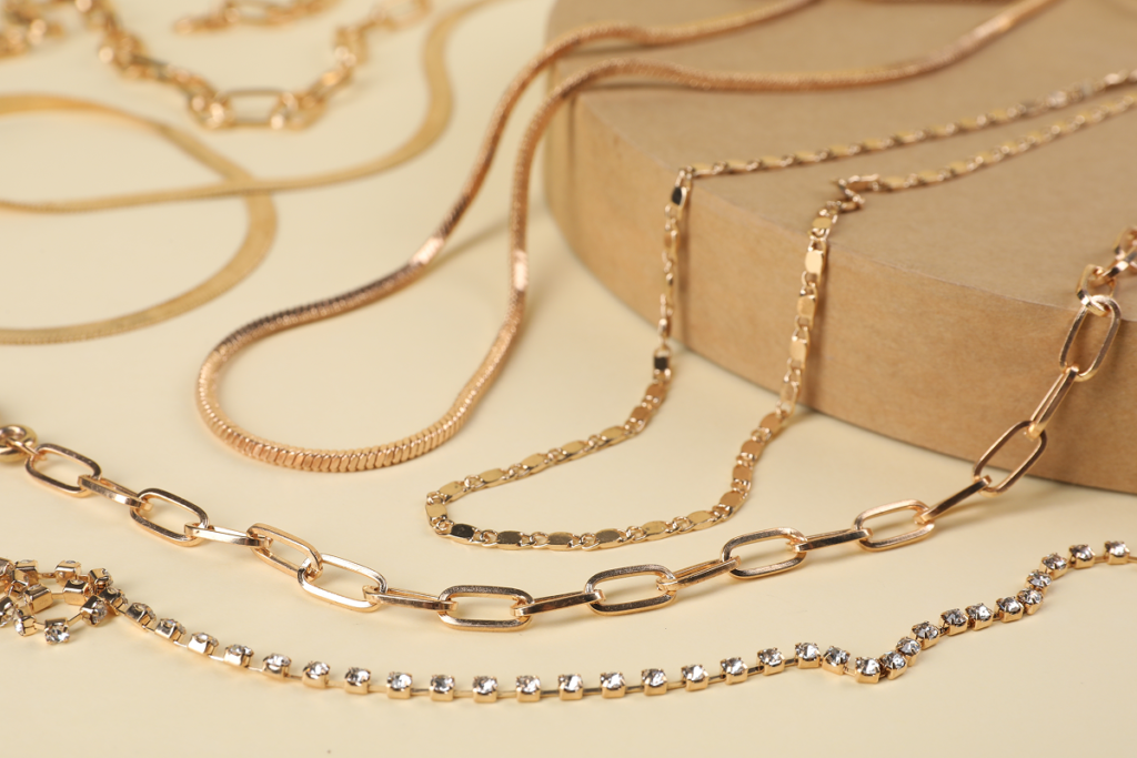 Different styles and constructions of gold chains displayed together